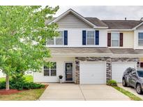 Charming townhome showcasing a stone facade, blue shutters and well-manicured landscaping at 2169 Shady Pond Dr, Clover, SC 29710