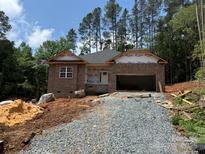 New construction, brick home with attached two car garage and wooded homesite at 2914 Waterford Ln # 33A, Albemarle, NC 28001