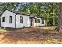 Charming home with white siding, black trim, and a welcoming front entrance at 1739 16Th Ne St, Hickory, NC 28601