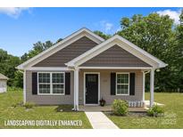 Charming single-story home with brown and tan siding, black shutters, and enhanced front lawn at 209 S Gregory St # 3, Lancaster, SC 29720