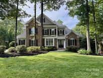 Beautiful stone and wood facade home with manicured lawn and mature trees at 238 Horton Grove Rd, Fort Mill, SC 29715