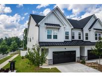 Beautiful two-story home with a two-car garage and manicured lawn at 4005 Easton Ridge Ln, Charlotte, NC 28226