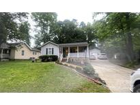 Charming single Gathering home with a beautiful front yard and a private driveway at 107 Oakland Rd, Belmont, NC 28012