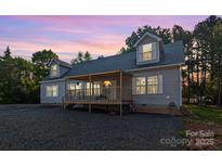 Charming home featuring a covered deck and beautiful sunset views at 1811 Continental Dr, Albemarle, NC 28001