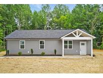 Charming single-story home featuring a gray exterior, simple landscaping, and a welcoming front porch at 195 Linda St, Salisbury, NC 28146