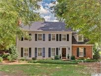 Charming two-story home featuring a well-maintained lawn and a combination of siding and brick exterior at 2311 Thornridge Rd, Charlotte, NC 28226