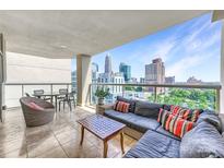 Spacious outdoor balcony featuring a comfortable seating area with a great view of the city skyline at 520 E Martin Luther King Jr Blvd # 1002, Charlotte, NC 28202