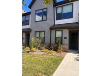 Charming townhome with inviting curb appeal, landscaped front yard and well-maintained exterior at 5931 Ardrey Kell Rd, Charlotte, NC 28277