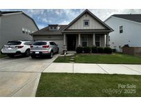 Charming single-Gathering home featuring a well-maintained lawn and convenient driveway at 333 Dudley Dr, Fort Mill, SC 29715