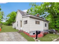 Quaint, charming exterior featuring a well-maintained yard and inviting entrance at 117 Young Sw Ave, Concord, NC 28025