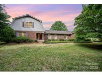 Charming brick home featuring a spacious front lawn and well-maintained landscaping at 4630 Woodleaf Rd, Salisbury, NC 28147