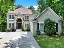 Stunning two-story home with a well-manicured lawn and a welcoming front entrance at 524 Wildbrook Walk, Fort Mill, SC 29708
