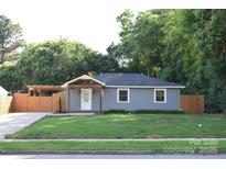 Charming single-story home with a well-maintained lawn and a quaint covered porch at 1109 Edwards St, Rock Hill, SC 29732