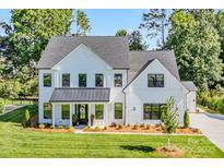 Beautiful new construction home with a modern farmhouse design and a large front yard at 1149 Rosecliff Dr, Waxhaw, NC 28173