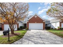 Charming single-Gathering home with well-manicured lawn and two-car garage at 284 Garnet Ct, Fort Mill, SC 29708