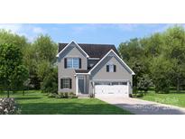 Charming two-story home with gray siding, black shutters, and a well-manicured lawn, creating a welcoming curb appeal at 490 Lenswood Ct, Denver, NC 28037