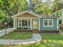 Charming single-story home featuring a welcoming front porch, well-maintained lawn, and inviting curb appeal at 1720 Chatham Ave, Charlotte, NC 28205