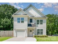 Charming two-story home with white siding, well-manicured lawn and attached garage at 3004 Marlowe Ave, Charlotte, NC 28208