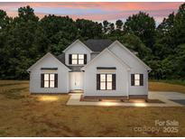 Charming new construction home featuring a modern farmhouse exterior and dark framed windows at 4975 Rimer Rd # 1, Concord, NC 28025