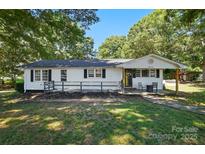 Charming single-story home with black shutters and freshly landscaped front yard at 2903 Price Rushing Rd, Monroe, NC 28110