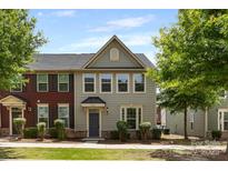 Charming townhome featuring well-maintained landscaping, a classic color scheme, and inviting curb appeal in a desirable neighborhood at 3039 Potomac River Pkwy, Charlotte, NC 28217