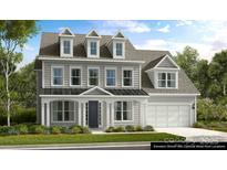Charming two-story home featuring a modern architectural design and well-manicured landscaping at 3058 Tramore Dr, Harrisburg, NC 28075