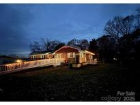 Charming brick home exterior at dusk, featuring a landscaped yard and inviting facade at 800 Charles Rd, Shelby, NC 28150