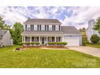 Charming two-story home features a well-manicured lawn and inviting front porch at 2024 Stonewyck Ave, Kannapolis, NC 28081