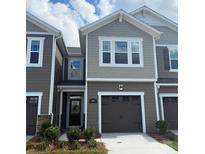 Charming townhome with a well-manicured lawn and a one-car garage at 300 Laura Elizabeth Ln, Clover, SC 29710