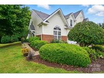 Charming home with lush landscaping, manicured bushes, and a well-maintained lawn at 3071 Des Prez Ave, Fort Mill, SC 29707
