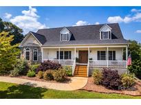 Charming home features a welcoming front porch and beautifully landscaped front yard at 5258 E Bandys Cross Rd, Catawba, NC 28609