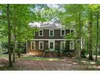 Charming two-story home with a neatly maintained front yard and beautiful surrounding trees at 2507 Connemara Dr, Matthews, NC 28105