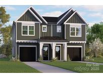Charming two-story home with a welcoming entrance and beautiful landscaping, featuring a tandem two-car garage at 5615 Lantana Ave # A, Charlotte, NC 28205