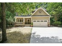 Charming craftsman-style home with a two-car garage and inviting front porch at 8521 Aspen Ct, Charlotte, NC 28227