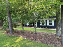 Charming home featuring a navy exterior, white trim, and lush landscaping at 172 Valleybrook Dr # 8, Denver, NC 28037