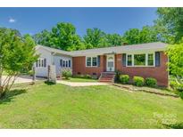 Charming single-story brick home with well-maintained lawn and mature trees at 286 Southside Rd, Rock Hill, SC 29730