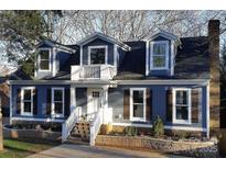 Charming home featuring beautiful blue siding, dormer windows, and a welcoming front porch at 3453 Selwyn Ave, Charlotte, NC 28209