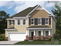 Two-story home featuring a covered porch with classic columns and a two-car garage at 4404 Dusty Orchard Rd, Kannapolis, NC 28081