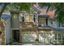 Charming townhome with stone accents, attached two car garage, and neutral siding at 2548 Chasewater Dr, Fort Mill, SC 29707