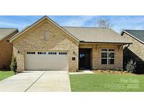 Beautiful brick home with a two-car garage and well-manicured lawn is move-in ready! at 409 Newstyle Way, Gastonia, NC 28056