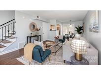 Cozy living room showcasing a stylish seating arrangement, hardwood floors, and modern decor at 4329 Hathaway St # D, Charlotte, NC 28211