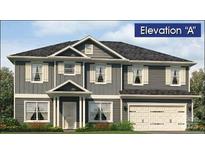 Charming two-story home with gray siding, white trim, and a two-car garage at 115 Kerr Walk Dr # 37, Statesville, NC 28677