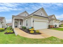 Charming single-story home featuring an attached garage and welcoming landscaped front yard at 17436 Hawks View Dr, Indian Land, SC 29707