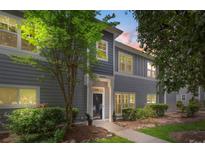 Charming gray two-story home featuring manicured landscaping, a welcoming entrance, and well-maintained siding at 18840 Silver Quay Dr # 12, Cornelius, NC 28031