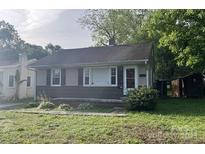 Charming single-story home featuring a well-maintained lawn and two sheds in the backyard at 327 Bonview Ave, Lincolnton, NC 28092