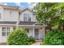 Charming townhouse featuring a well-maintained yard with mature landscaping and a welcoming front porch at 4124 Melrose Club Dr, Matthews, NC 28105