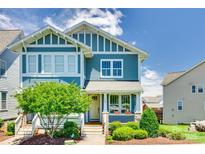 Charming blue two-story home with landscaped front yard and a welcoming porch at 750 Waterscape Ct, Rock Hill, SC 29730