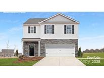 Two-story home with stone accents, a two-car garage, and a welcoming front porch at 925 Two Brothers Ln, York, SC 29745