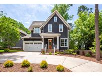 Charming two-story home with manicured landscaping and a two-car garage at 1620 Arnold Dr, Charlotte, NC 28205
