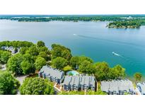 Beautiful aerial view of waterfront condos, swimming pool, and boats on the lake at 302 Northwest Dr, Davidson, NC 28036